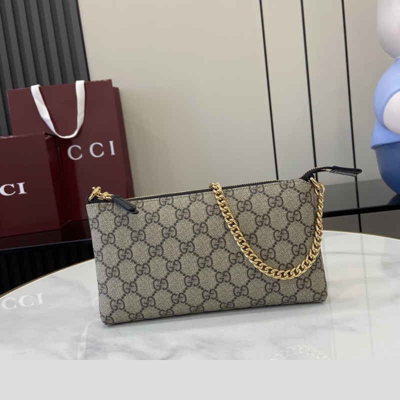 G*u*i clutch bags